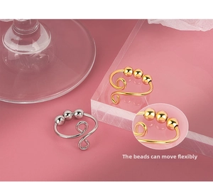Detail view of adjustable anti-stress ring with three rotatable sliding metal beads
