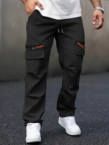 Detailed view of men's black cargo pants showing zipper pockets and high-quality fabric