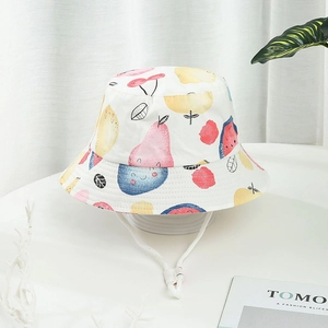 Toddler white cotton sun hat with colorful fruit patterns and adjustable chin strap