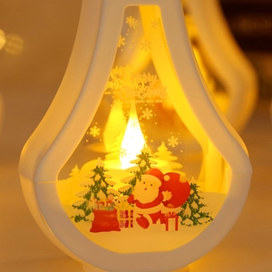 Close-up of white vintage Christmas LED lantern with Santa Claus and warm bokeh lights