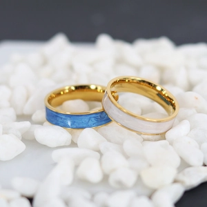 Blue and white marble enamel rings in 18K gold plated stainless steel on white stones