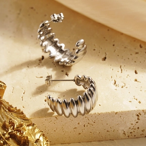 Silver wavy C-shaped titanium steel earrings with a retro hammered texture for women