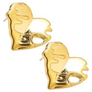 Macro detail of gold-plated abstract heart stud earrings with unique liquid metal texture