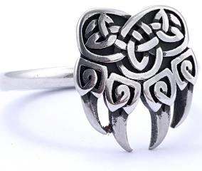 Detailed view of silver Viking ring featuring a bear paw print and Celtic knots