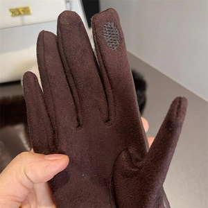 Close-up of brown suede touch screen glove showing high-quality winter fabric detail
