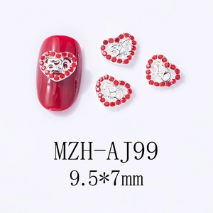 Close-up of heart-shaped nail charm with 520 engraving and red rhinestones, 9.5x7mm