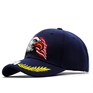 Navy blue baseball cap featuring eagle and American flag embroidery in a sporty style