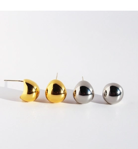 Polished gold and silver teardrop stud earrings displayed on a clean white background