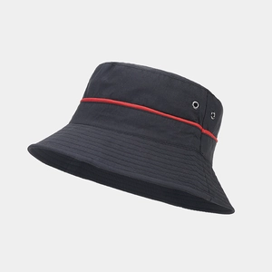 Detail of black waterproof bucket hat with red stitching and metal ventilation eyelets