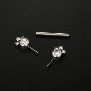 Polished stainless steel nipple barbell with bezel-set cubic zirconia in Mickey shape