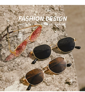 Three pairs of stylish metal frame sunglasses in pink, black, and tea displayed on a rock