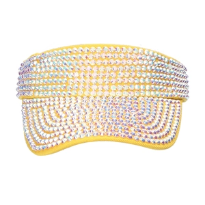 Detail of yellow sun visor hat with sparkling rhinestones for outdoor summer activities