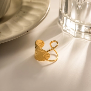 Irregular gold hollow geometric ring with hammered texture and minimalist open design