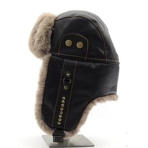 Close-up of leather trapper hat featuring soft faux fur lining and brass buckle details