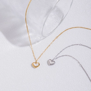 Luxury titanium steel heart necklace with white shell inlay in gold and silver finish