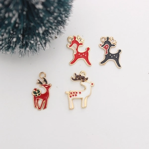 Close-up of colorful enamel reindeer charms with glitter for Christmas DIY jewelry