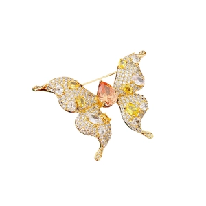Elegant gold-plated butterfly brooch with sparkling white, yellow, and orange zircons