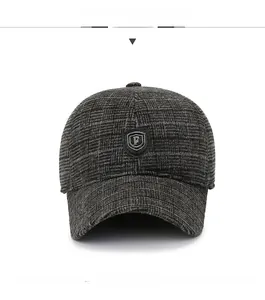 Front view of a dark grey plaid baseball cap with warm fleece lining and shield logo