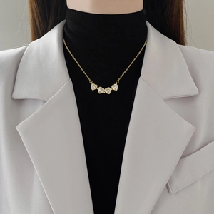 Titanium steel gold four-leaf clover necklace with sparkling zircon heart crystals