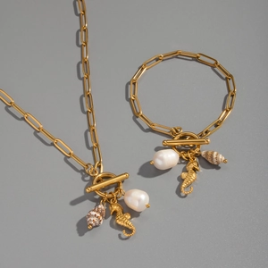 Set of 18K gold-plated necklace and bracelet with seahorse, pearl, and shell charms