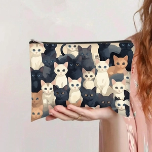 Vue détaillée d'une trousse à maquillage en toile à imprimé chat avec fermeture éclair