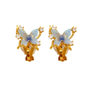 Exquisite 18k gold plated butterfly ear clips with blue resin wings and white zircons