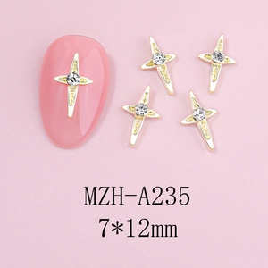 Detailed view of 7x12mm gold alloy cross nail charms with rhinestones on pink background