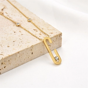 Minimalist 18K gold stainless steel C-shaped paperclip necklace with sparkling crystals