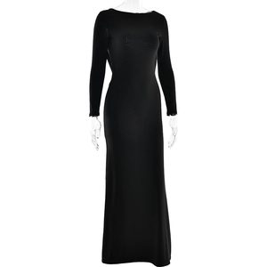 Front view detail of a full-length black long-sleeve maxi dress with a sleek slim fit