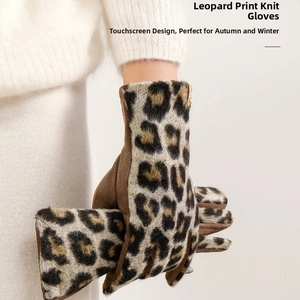 Close-up of leopard print winter gloves with touchscreen fingertips for cold weather