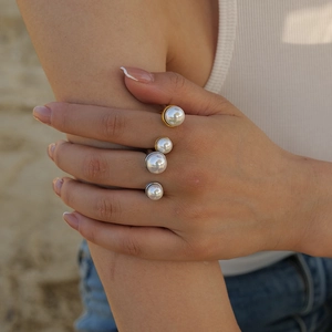 18K gold plated stainless steel open ring with large white pearls on female hand