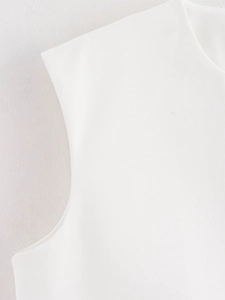 Detail showing high-quality white woven fabric texture and seamless armhole stitching