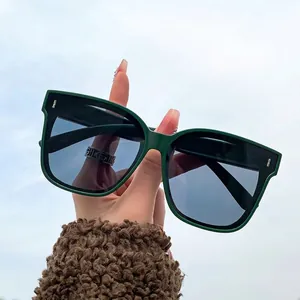 Polarized square sunglasses with matte dark green frame and golden side metal accents