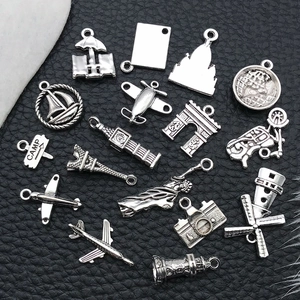 Silver metal travel charms set featuring Eiffel Tower airplane and camera for DIY jewelry