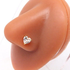 Golden heart-shaped zircon nose stud earring on mannequin for professional body jewelry display