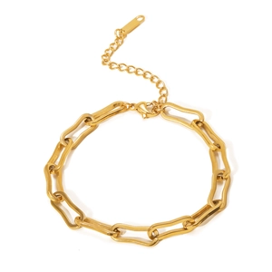 Detail shot of a golden chunky chain bracelet with an adjustable extension link and clasp