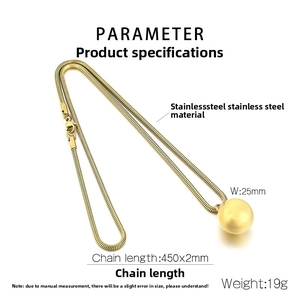 Macro detail of a 25mm gold spherical pendant on a 2mm stainless steel snake chain
