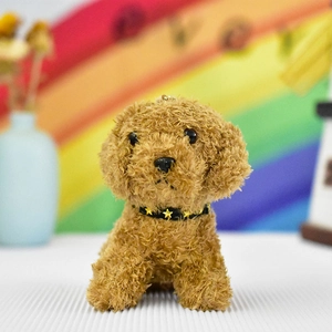 Close-up view of a cute brown curly plush dog keychain featuring a gold star collar