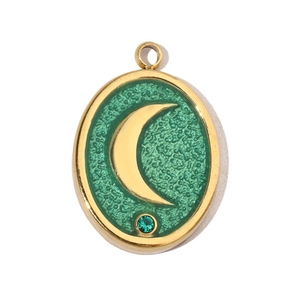 Detailed view of a gold crescent moon charm with green texture and a tiny green gemstone