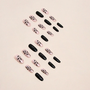 Oval black silhouette leaf press-on nails set with minimalist glossy black design