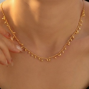 18k gold plated copper necklace with ball-and-gourd tassel pendants worn on neck