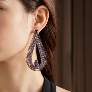 Exquisite hollow teardrop earrings featuring purple zircon crystals for fashion styling