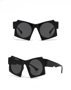 Front and side views of black geometric irregular frame sunglasses with dark lenses