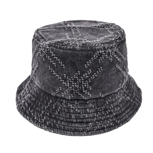 Detail of washed grey denim bucket hat featuring white cross-stitch star embroidery