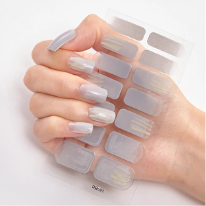 Detail view of model holding solid grey self-adhesive nail stickers sheet DQ-01