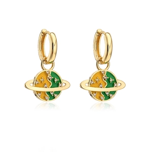 Macro shot of 18K gold plated globe earrings with green enamel and zircon stones