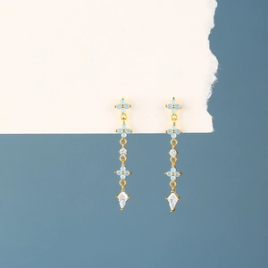 Detail of s925 silver champagne gold long tassel earrings with blue flower stone