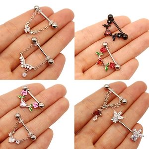 Detailed view of stainless steel nipple rings with rose, mushroom and heart charms