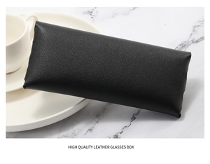 Detail of high quality black lychee grain leather texture on soft portable glasses pouch