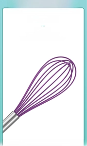 Close-up of flexible purple silicone whisk head with a stainless steel handle for baking